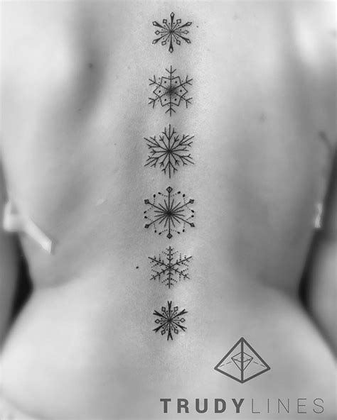 Snowflakes Spine Tattoo