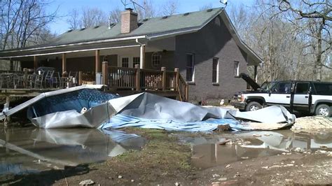 Family rescued after flooding traps them inside home