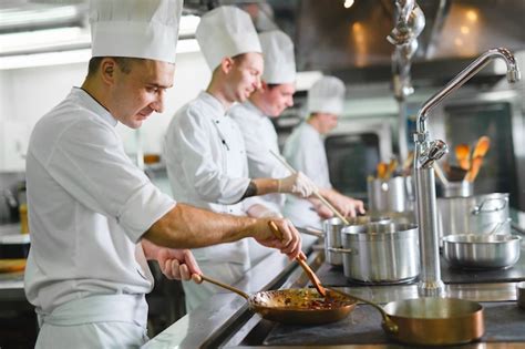 Premium Photo | Cook cooks in a restaurant.