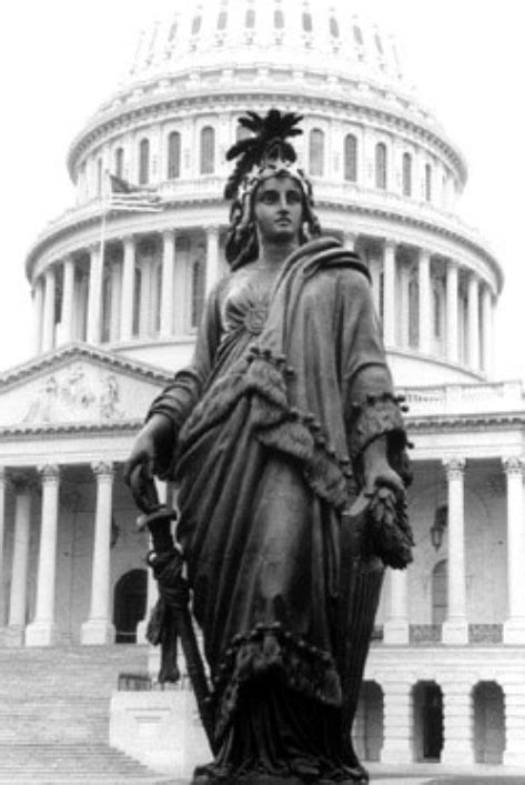 » Columbia statue which crowns the U.S. Capitol Building, wearing a ...