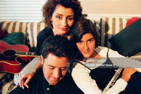 Singer Vince Gill poses for a photo with his wife, Janis Gill, and ...