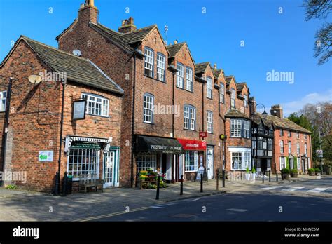 Shops and restaurants along the main street of Prestbury a historic ...