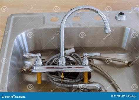 Installing a Stainless Steel Kitchen Sink. Stock Image - Image of ...