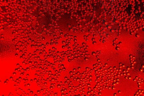 Premium Photo | Red macro water drop texture,water drops on red background