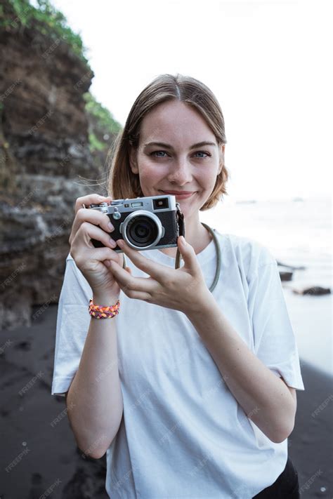 Premium Photo | Beautiful female photographer on the beach