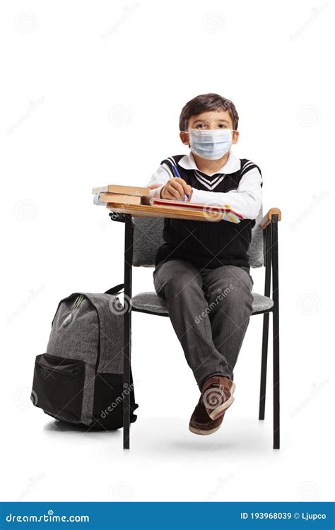 Schoolboy Sitting in a School Chair with a Protective Face Mask Stock Image - Image of schoolboy ...