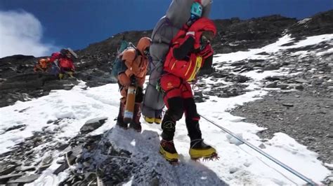 Watch: Sherpa carries Everest climber in ‘death zone’ rescue