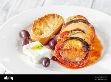 Portion of Briam Greek Vegetable Bake with feta Stock Photo - Alamy