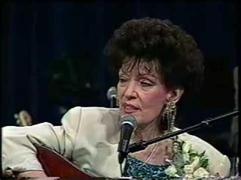 Dottie Rambo performs her classic song "Sheltered In The Arms Of God" and tells the touching ...