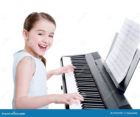 Smiling Girl Plays on the Electric Piano. Stock Image - Image of electric, people: 59137091