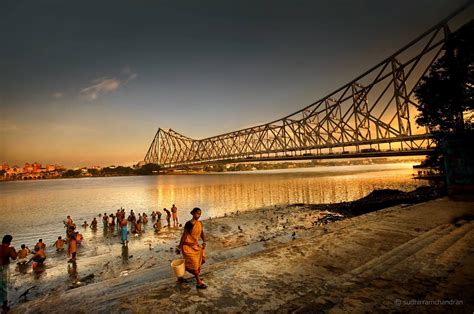 I waited till the golden sunset struck the metal cantilever structure of the Howrah bridge over ...