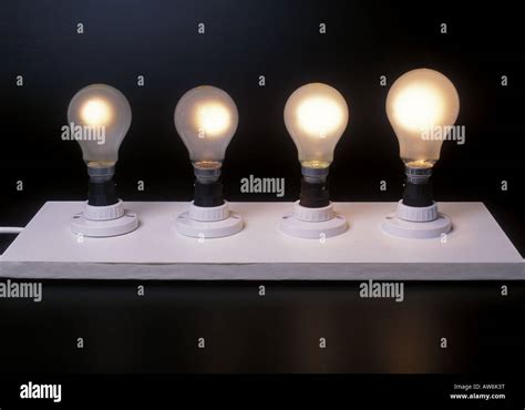 Four different wattage light bulbs 40w 60w 100w 150w Stock Photo - Alamy