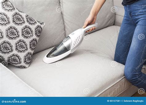 Woman with Handheld Vacuum Cleaning on Sofa Stock Image - Image of ...