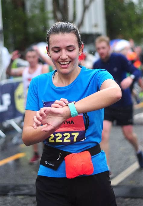 Manchester Half Marathon in pictures: Runners brave the torrential rain to complete route ...