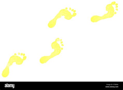 Four yellow footprints Stock Photo - Alamy