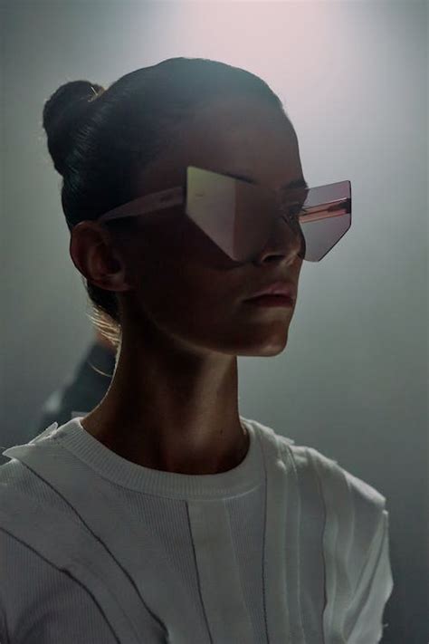 Dark portrait of woman in futuristic sunglasses · Free Stock Photo