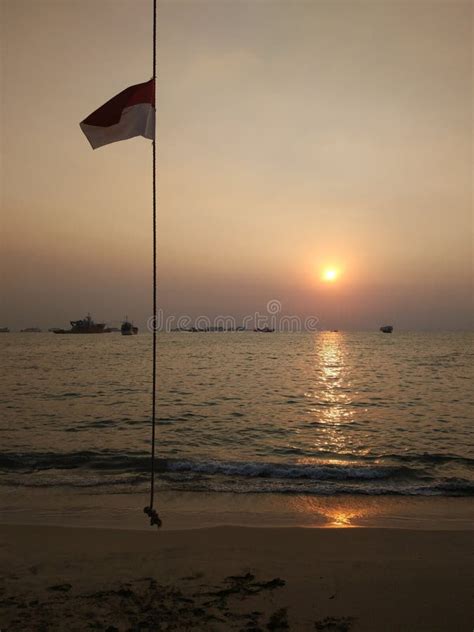 Sunset on the Beach with the Flag of Indonesia in the Foreground Stock ...