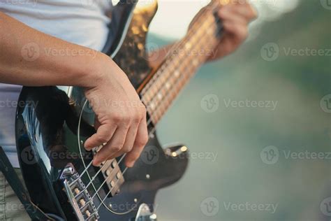 Electric bass played during a show 11543796 Stock Photo at Vecteezy