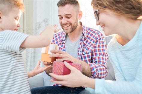 Boy Giving Presents To Parents - Stock Photos | Motion Array