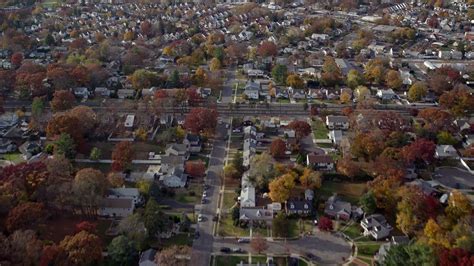 5.5K stock footage aerial video fly over golf course and suburbs in Autumn, West Hempstead, New ...