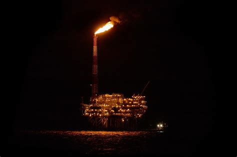 Oil Rig At Night Photograph by Bradford Martin