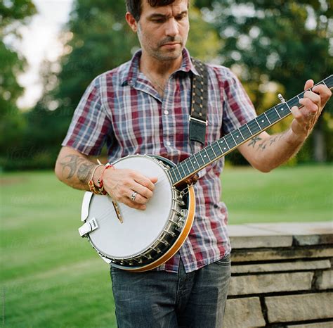 "Handsome Man Playing Banjo In A Park" by Stocksy Contributor "Jakob ...