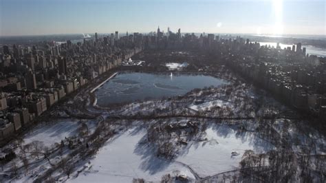 Central Park in snow New York City Aerial Stock Footage AX66_0103