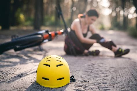 Premium Photo | Protective helmet on forest road bike accident