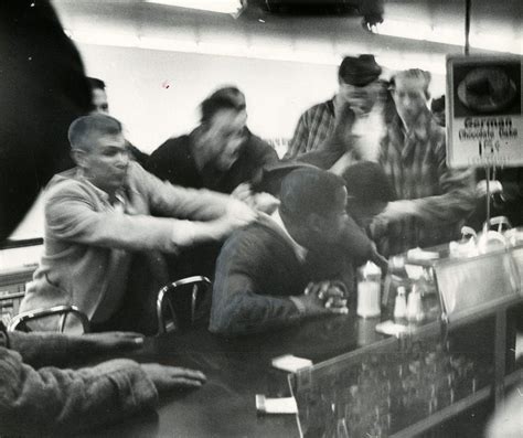 John Lewis is pulled off a stool during a sit-in at a segregated lunch ...