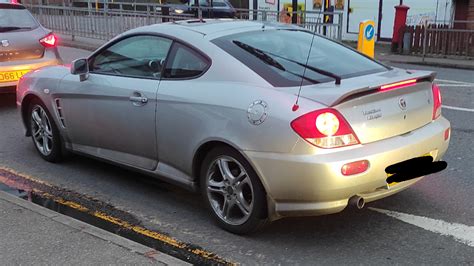 [Hyundai Coupe] This guy rebadged it as "Toscani Motors". He even changed badges on the rims ...