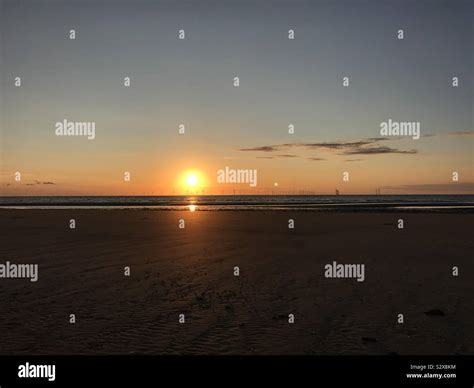 Sunset over New Brighton beach Stock Photo - Alamy