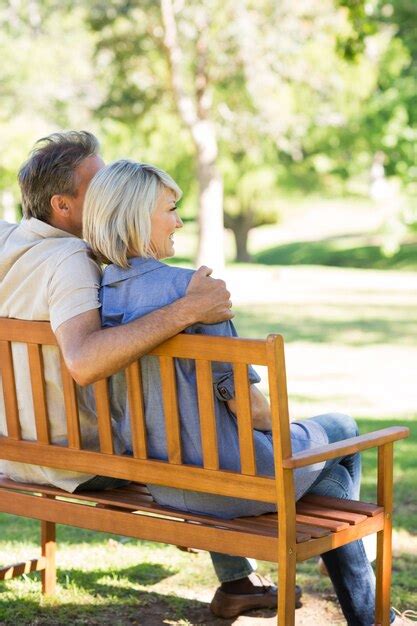 Premium Photo | Couple relaxing on park bench