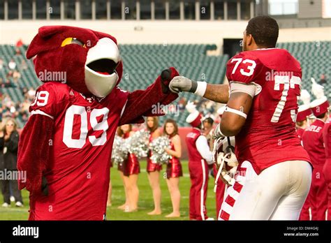 Temple Owls mascot, Hooter, gets a fist bump from Temple Owls offensive ...