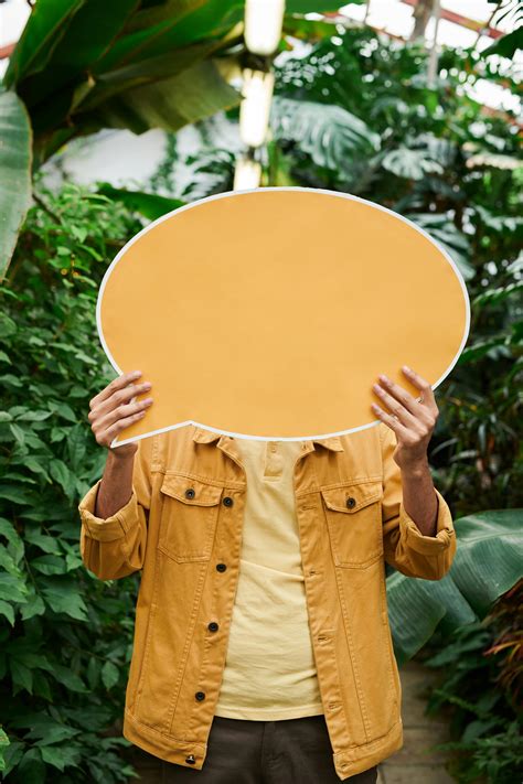 Photo Of Man Holding Signage · Free Stock Photo