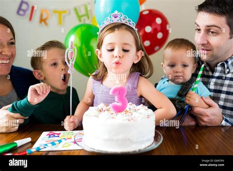 Family with three children (2-3, 4-5) celebrating birthday Stock Photo - Alamy