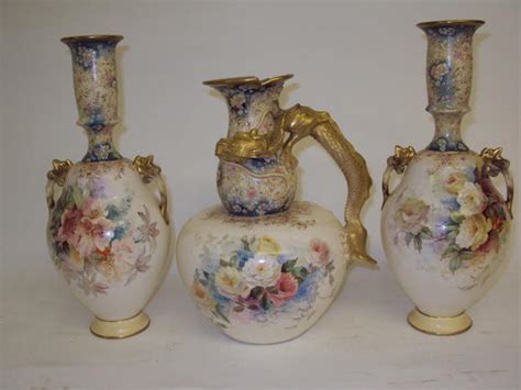 Bonhams : A garniture of three Doulton Burslem vases