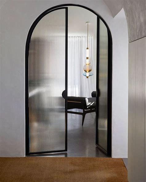 STUDIO BLACK INTERIORS | MARIA CERNE on Instagram: "Arched steel doors ...