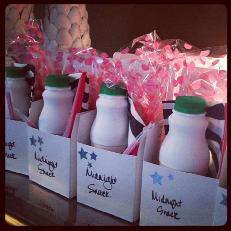 several small bottles filled with milk on top of a table