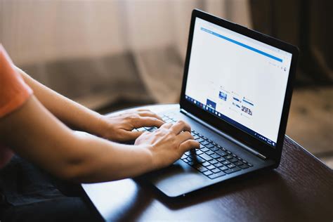 Person Typing on Laptop. · Free Stock Photo