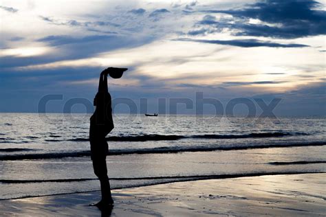 Silhouette girl on beach | Stock image | Colourbox