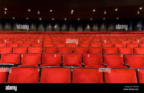 Red velvet concert hall seating background Stock Photo - Alamy