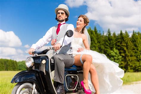 Bridal Pair Driving Motor Scooter Wearing Gown and Suit Stock Image ...