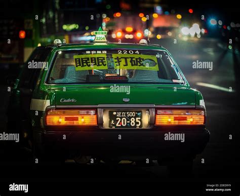 Tokyo Taxi at night with illuminated sign. Tokyo Night Taxi Stock Photo ...