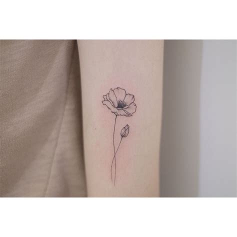 I like the look of this poppy flower Poppy by sohye_tattoo_ | Tiny flower tattoos, Small flower ...