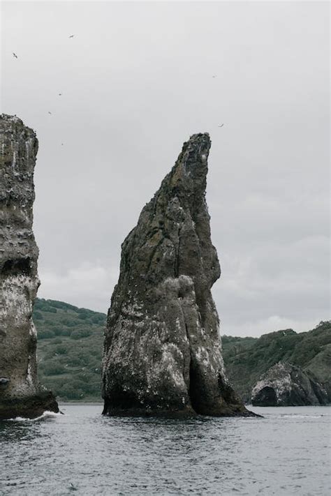 A Big Rock Formation in the Sea · Free Stock Photo