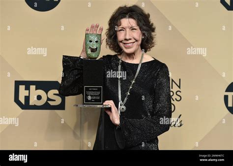 Lily Tomlin poses in the press room with the Lifetime Achievement Award at the 23rd annual ...