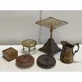 A good selection of collectables including brass trivets, a Oriental wooden vase stand, cigarette di