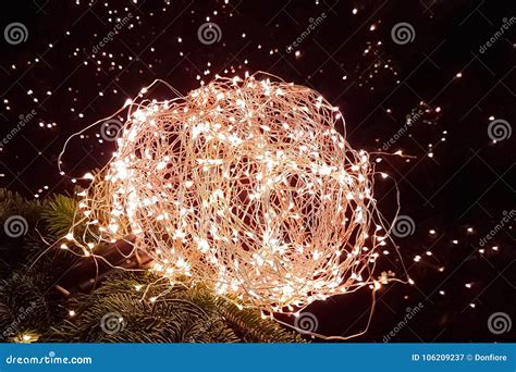 Abstract Christmas Glitter Lights Ball on Xmas Tree with Warm Sp Stock Image - Image of ...