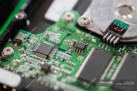 Close-up of an opened hard drive in repair shop — storage, electronics - Stock Photo | #225304638