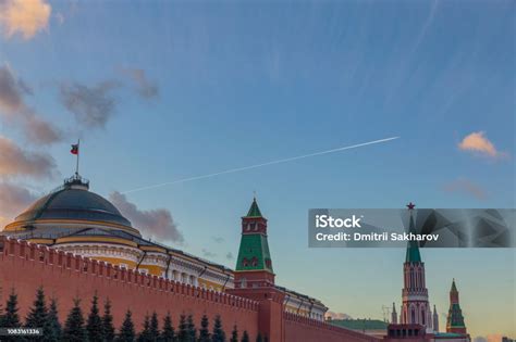 Kremlin Wall And Towers In The Evening And An Airplane Flying By Stock ...
